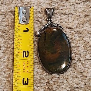 Striking Silver and Green Stone Pendant